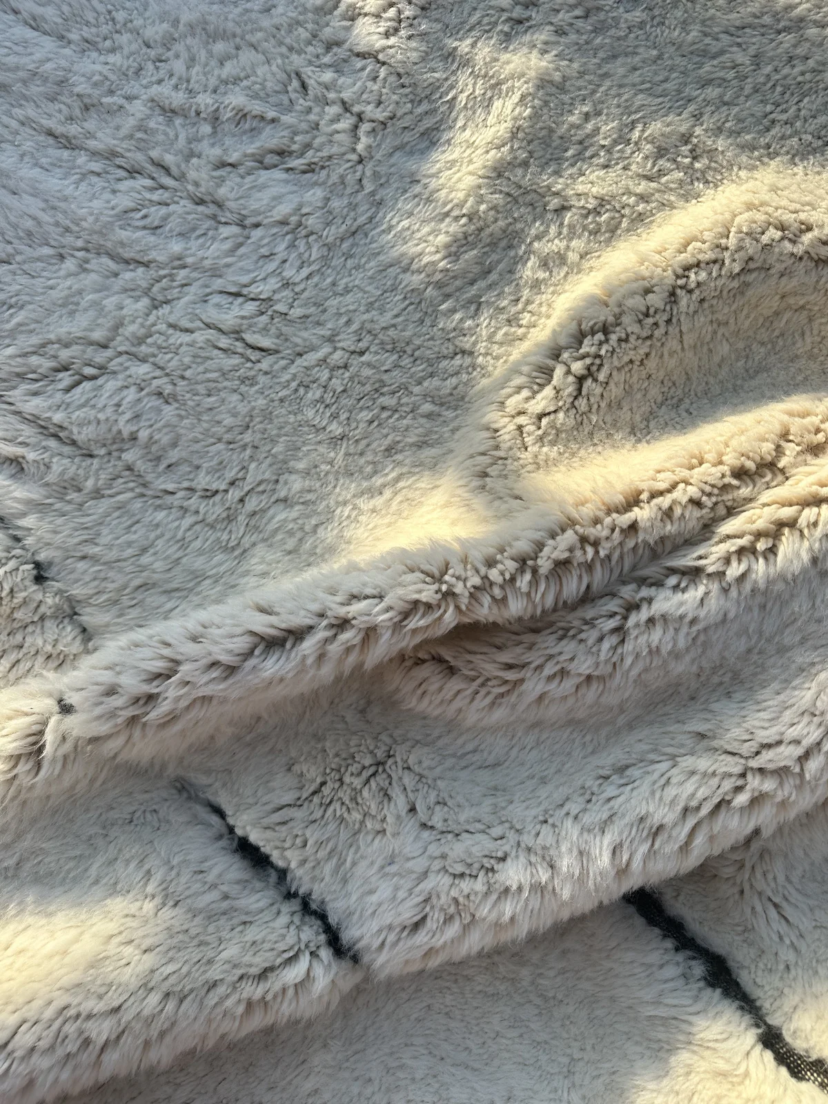 Close-up of the dense wool pile of an Azral rug