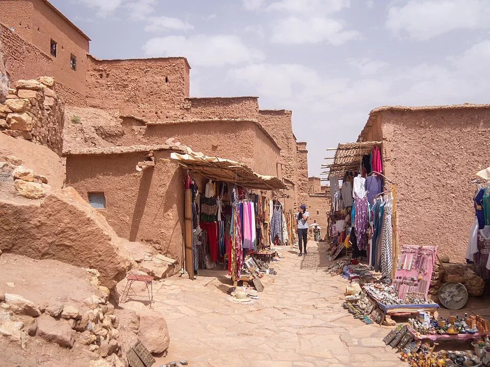 The earthen towers of Ait Benhaddou, where the same geometry that appears in Amazigh weaving is built into stone
