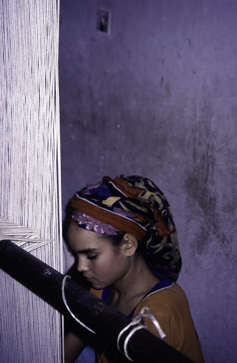 Portrait of a Moroccan weaver at work