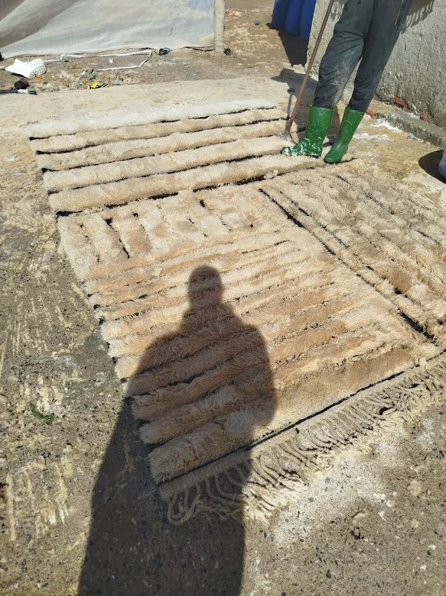 Open-air washing zone between Khenifra and Mrirt where rugs are rinsed