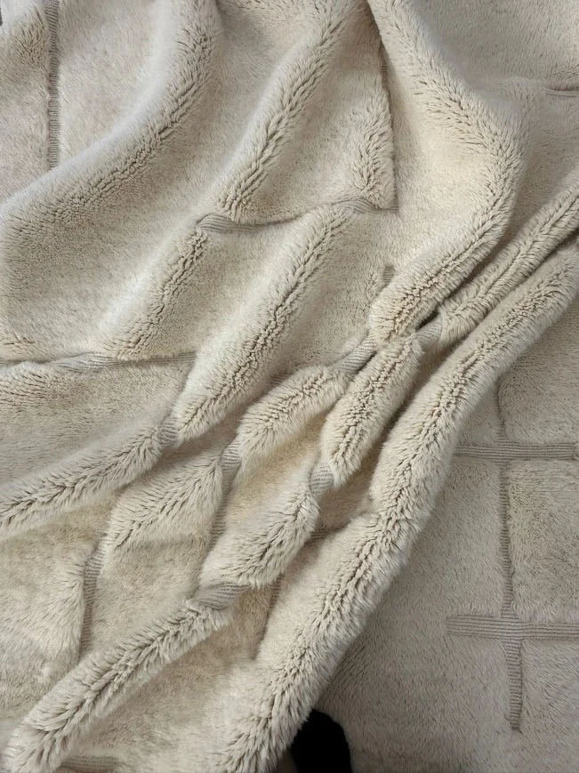 Close detail of a handwoven Azral rug at home